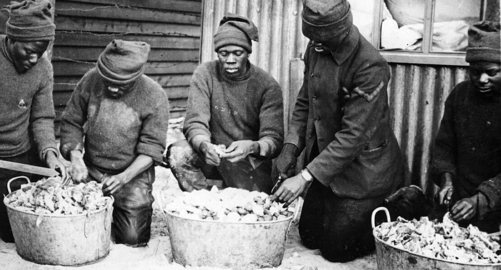 Men of the South African Native Labour Contingent preparing food
